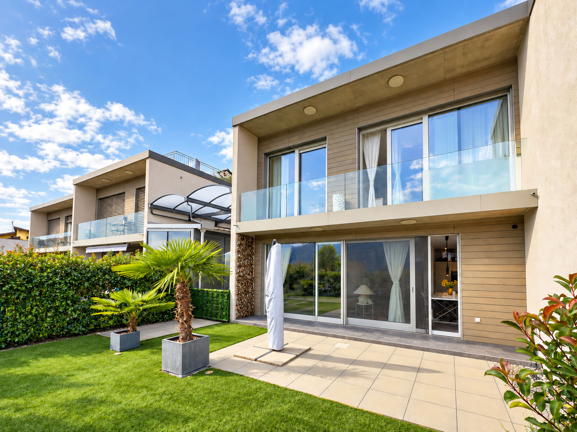 Casa a schiera con giardino e vista aperta in vendita ad Agno Casa a schiera con giardino e vista aperta in vendita ad Agno